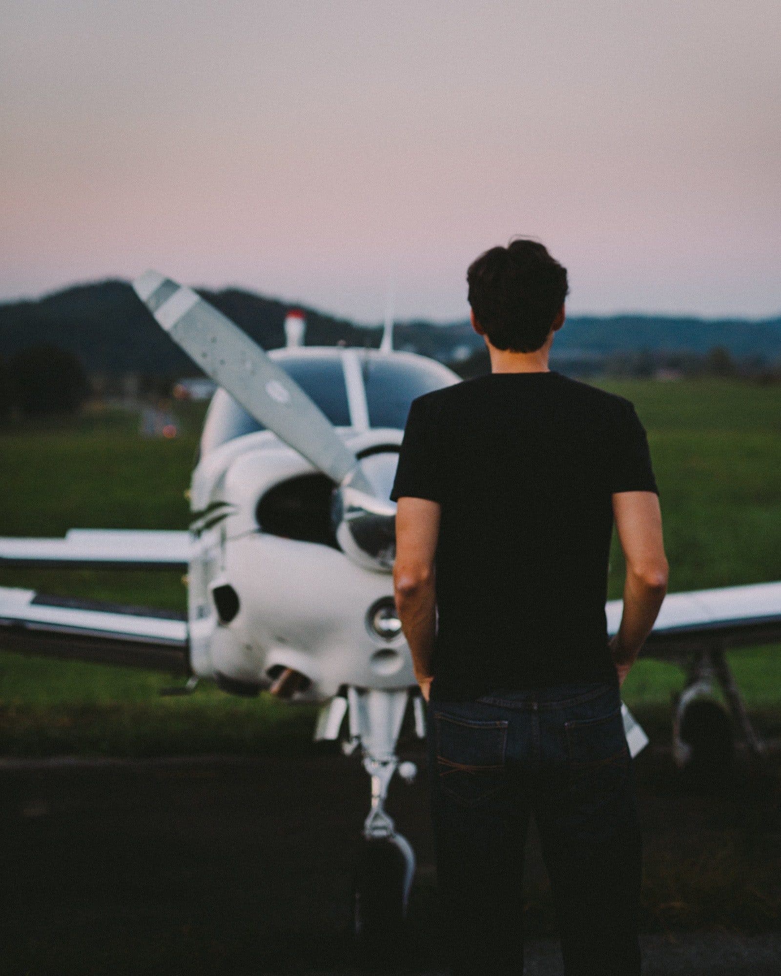 Man looking at airplane.